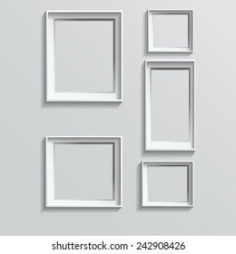 Set of white photo frames on grey background