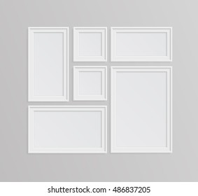 Set of white photo frames on gray background