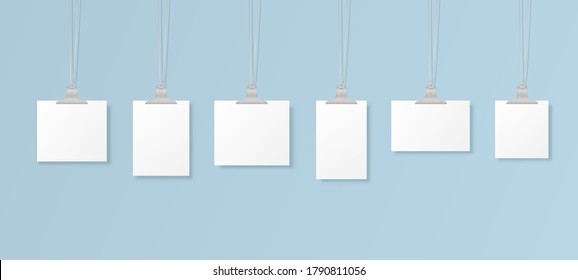 A set of white poster mockups hanging on binder on the wall. Frame for a sheet of paper. Blank hanging photo frames or poster templates isolated on background. Vector illustration.