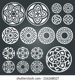 A set of of white round geometric designs isolated on chalkboard background. Vector symbols and signs illustration. All objects are separated, the can be scaled or recolored without quality loss. 