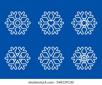set of white snowflakes icons on blue background
