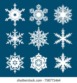 Set of white snowflakes isolated on blue background. Vector illustration.
