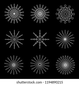 Set of white snowflakes on a black background