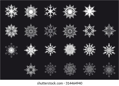 set of white snowflakes on a black background