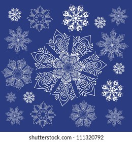 Set of white snowflakes on blue backgorund