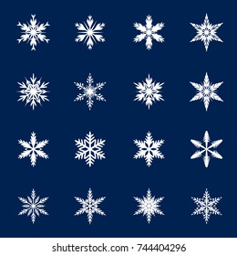 Set of white snowflakes on blue background. Vector isolated icons. Winter stars and Christmas decoration.