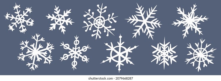 Conjunto de copos de nieve blancos sobre un fondo gris oscuro. Colección de varios copos de nieve a mano estilo doodle. Símbolo de nieve de invierno. Elementos para el diseño navideño de invierno. Vector.