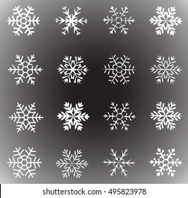 set of white snowflakes on a dark background