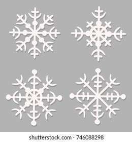 set of white snowflakes on a gray background