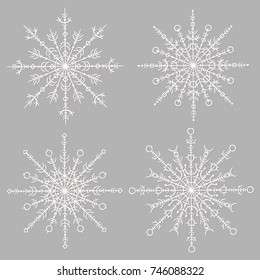 set of white snowflakes on a gray background