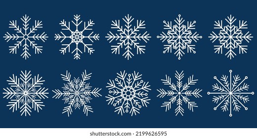 A set of white vector snowflakes on a blue background