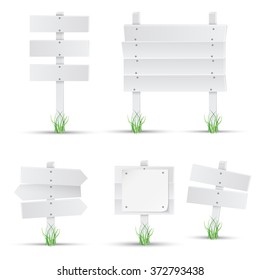 Set of white wooden signs with grass. Vector. 