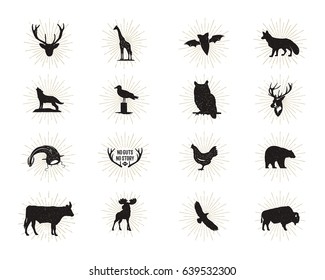 Set of wild animal figures and shapes with sunbursts isolated on white background. Black silhouettes wolf, deer, moose, bison, eagle, seagull, cow, and owl. Animals shapes bundle. Vector.