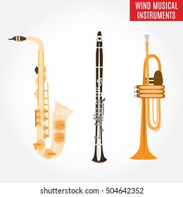 Set of wind musical instruments. Vector illustration of saxophone, clarinet and trumpet isolated on white background. Woodwind and brass musical instruments.