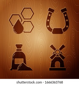 Set Windmill, Honeycomb, Bag of flour and Horseshoe on wooden background. Vector