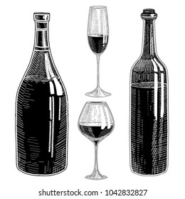Set of wine bottles and glasses with grape wine