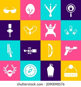 Set Winter hat, Pistol or gun, Cartridges, Bird footprint, Slingshot, Torch flame, Glasses and Bear skin icon. Vector