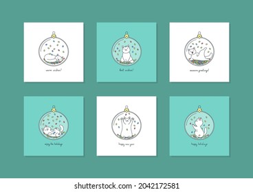 Set of winter holiday card templates. Collection of greeting cards with cute white cats playing with confetti in glass christmas balls.