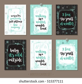 Set winter and holidays greeting cards with handwritten brush calligraphy and decorative elements. Decorative vector illustration for season invitations, cards, posters and flyers.