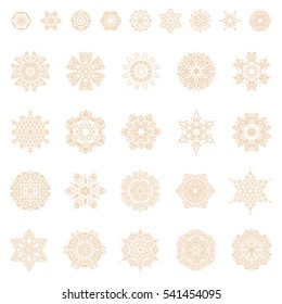 Set of winter New Year snowflakes in beige colors on white.