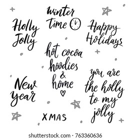 Set of winter quotes: You are the holly to my jolly, very merry xmas, new year, happy holidays, hot cocoa hoodies and home, winter time.