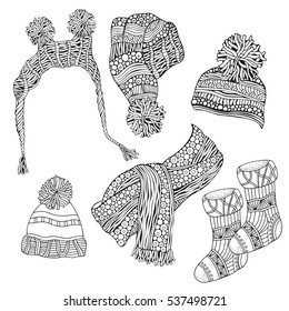 Set of winter sketches. warm clothes,  scarf, hats, socks. Hand-drawn vector illustration. Coloring book page