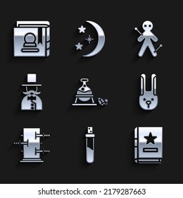 Set Witch cauldron and magic stone, Bottle with love potion, Ancient book, Rabbit ears, Trunk for tricks, Magician, Voodoo doll and  icon. Vector