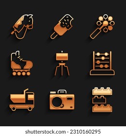 Set Wood easel, Photo camera, Toy building block bricks, Abacus, truck, Roller skate, Rattle baby toy and horse icon. Vector