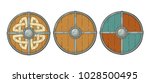 Set wood round shields with viking runes and iron border. Vintage vector color engraving illustration. Isolated on white background. Hand drawn design element for poster, label, tattoo