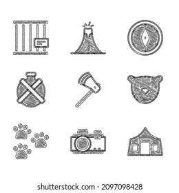 Set Wooden axe, Photo camera, Tourist tent, Tiger head, Paw print, Canteen water bottle, Compass and Animal cage icon. Vector