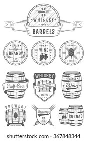 Set of wooden casks with alcohol drinks emblems and labels. Set of vintage logo, badge, template with wooden barrels for beer house, bar, pub, wine and whiskey market, brewery, restaurant and winery.