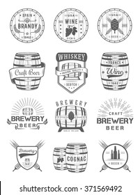 Set of wooden casks with alcohol drinks emblems and labels. Set of vintage logo, badge, template with wooden barrels for beer house, bar, pub, wine and whiskey market, brewery, restaurant and winery.