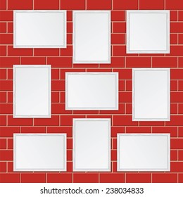 Set of  wooden frames isolated on the wall of red bricks