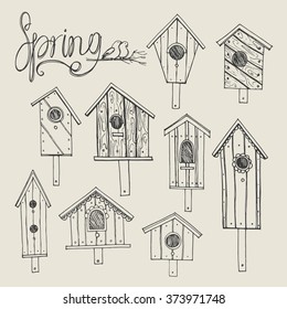 Set from the wooden nesting boxes drawn by hand.Birdhouse made of boards.Vector illustration.Isolated.