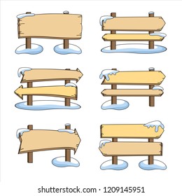 Set of wooden pointers in the snow