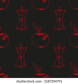 A set of wormy apple and apple core in red on a black background. Creative fruit background.