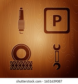 Ponga llave, bujía de Camión, rueda de Camión y estacionamiento en fondo de madera. Vector