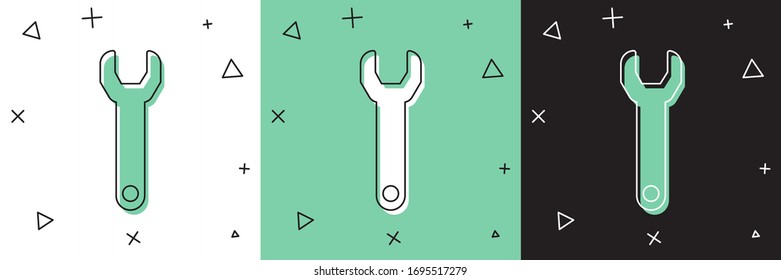 Ajuste el icono de la llave inglesa aislada en fondo blanco y verde y negro. Ilustración vectorial