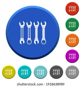 Set of wrenches round color beveled buttons with smooth surfaces and flat white icons