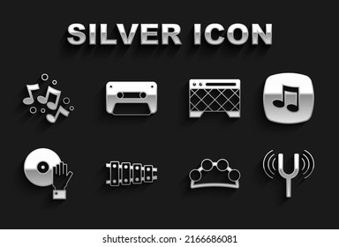 Set Xylophone, Music note, tone, Musical tuning fork, Tambourine, DJ playing music, Guitar amplifier,  and Retro audio cassette tape icon. Vector