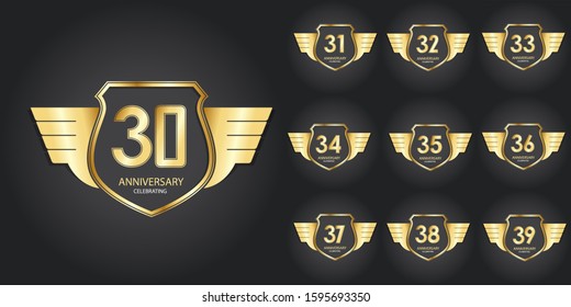 Set years anniversary design logotype 3D golden stylized modern shape winged shield on black background for celebration event