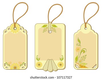 Set yellow and beige labels tags with floral pattern and ropes. Vector