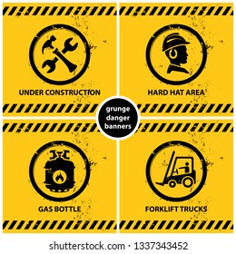 set of yellow grunge warning banners containing four official international hazard symbols, eps10 vector illustration