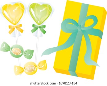 Set of yellow heart-shaped candy for white day and the box with ribbon