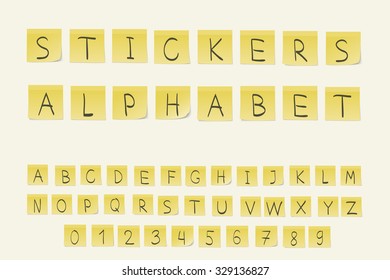 Set of yellow stickers with written alphabet letters and numbers.