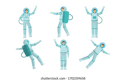 Set of young austronauts in special metallic costume in outer space