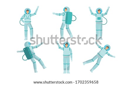 Set of young austronauts in special metallic costume in outer space