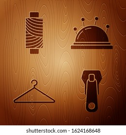 Set Zipper, Sewing thread on spool, Hanger wardrobe and Needle bed and needles on wooden background. Vector
