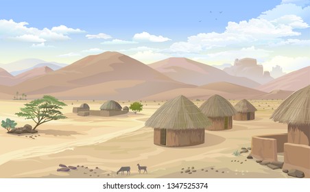 Um assentamento com pequenas cabanas no meio das montanhas do deserto