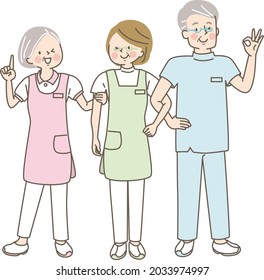 Seven international healthcare workers laughing with their arms crossed